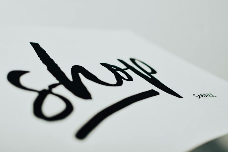 Close-up of a handwritten sign promoting support for small businesses.